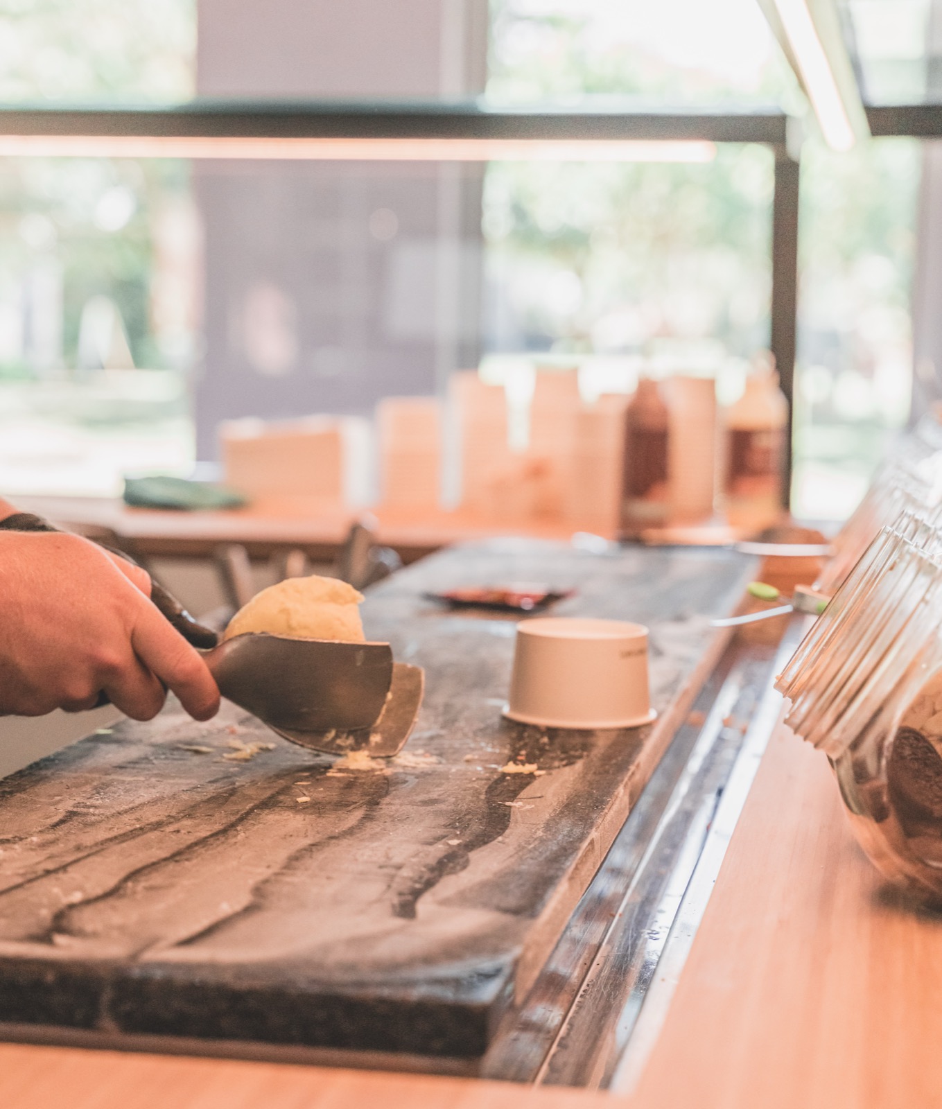 Scooping ice cream onto the frozen slab